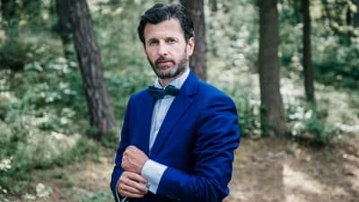 Juraj Liška in a blue suit, portrait for Luxus magazine